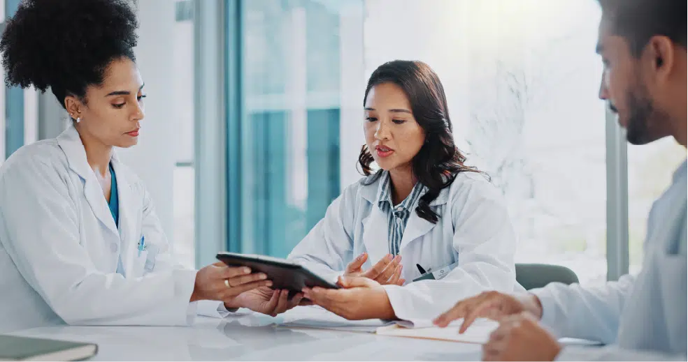 doctors reviewing case with tablet